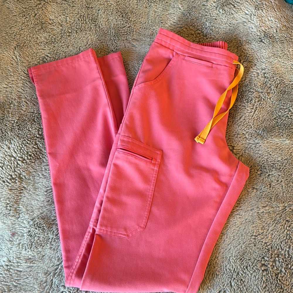 Figs neon pink Yola scrub pants.